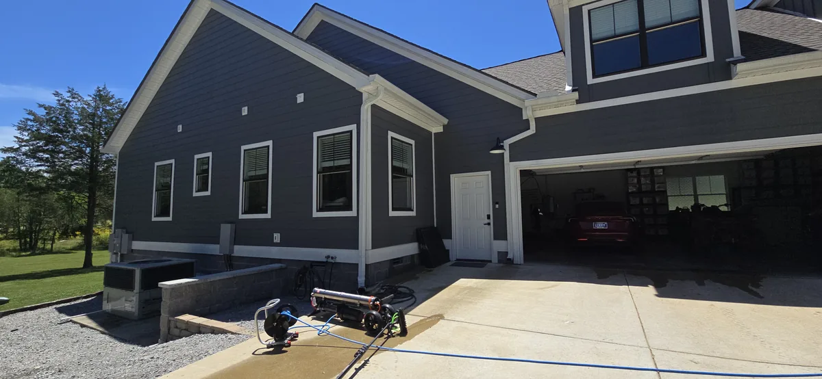 Glass Masters technician delivering streak-free window cleaning results